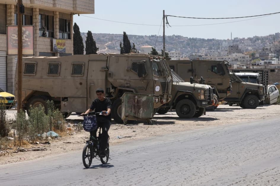 Israeli settlers attack West Bank village, blocking family's return home