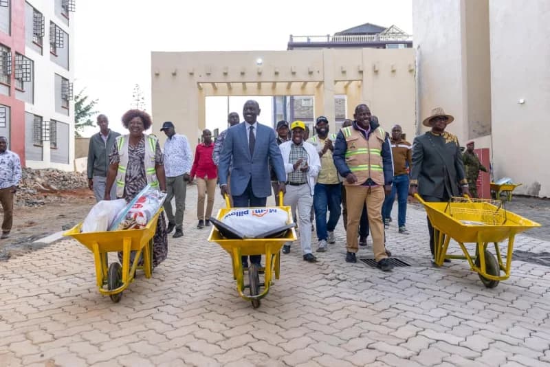 Ruto uses wheelbarrow to help families move into new Eldoret homes