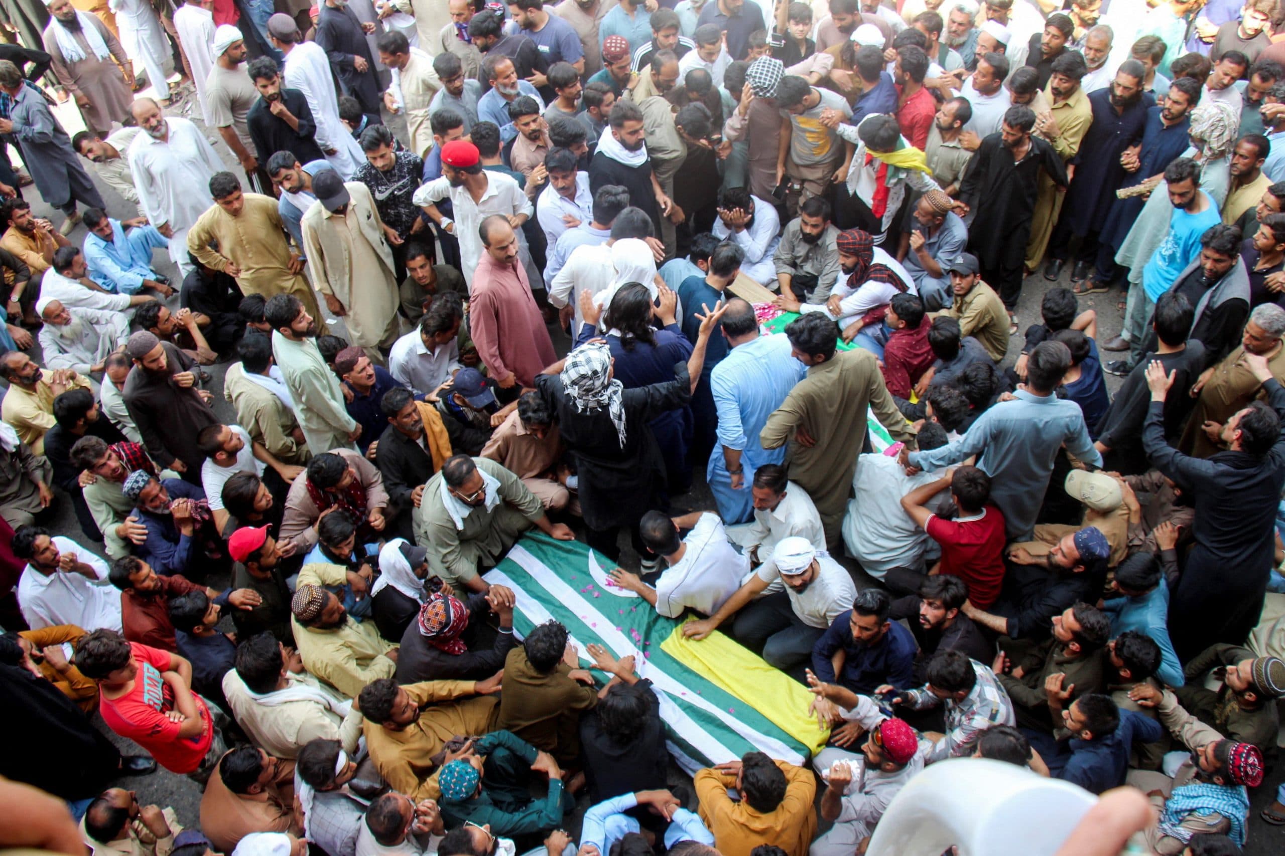 Thousands march in Pakistan-administered Kashmir as clashes kill at least 15