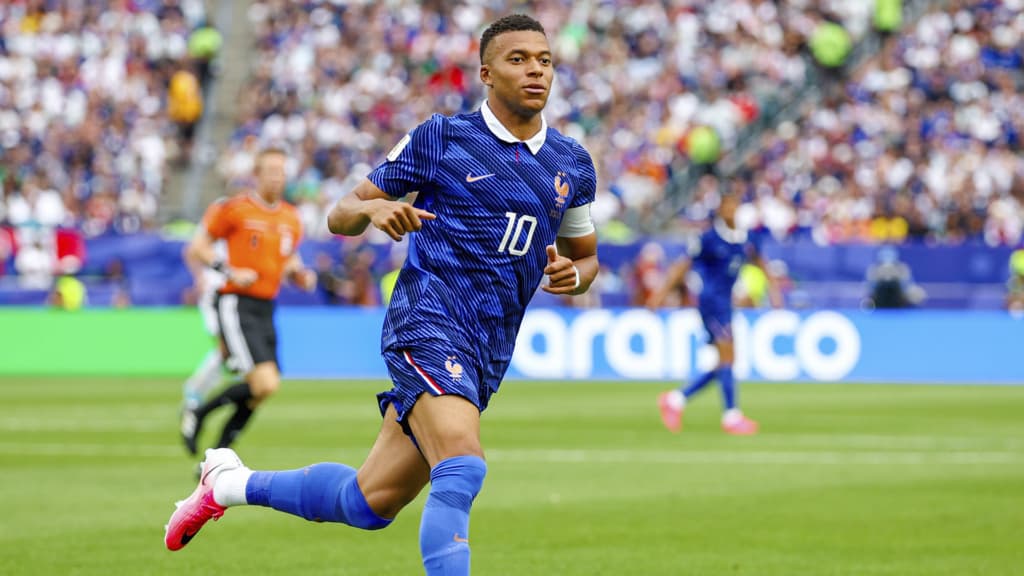 Mbappe ties Klose with 16 World Cup goals as France secure last 32 spot despite storm delay
