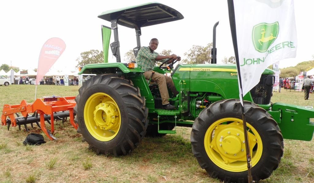 Farmers ordering tractor services by phone