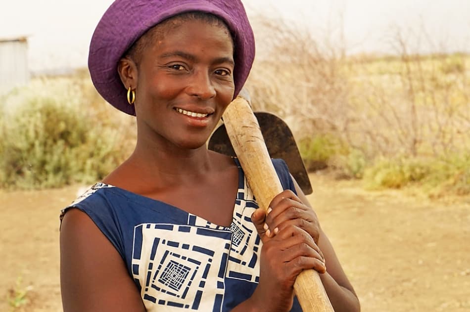 Refugee changing her life by growing sweet potato, okra and kale in her camp kitchen garden