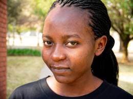 17 year old girl behind rabbit cooperative and village bank