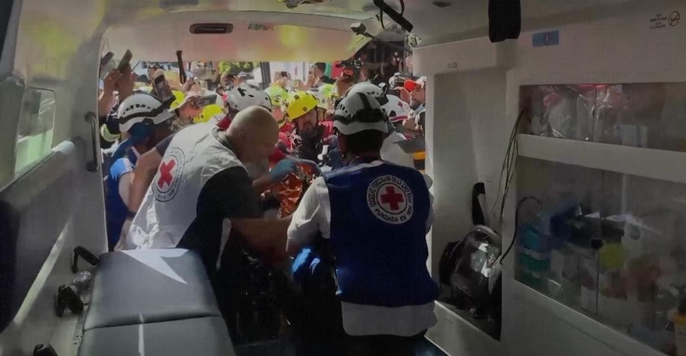 Venezuela quake survivor pulled out alive after eight days